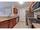 A well-lit kitchen with stainless steel appliances, granite countertops, and wooden cabinetry at 7885 W Flamingo Rd # 1016, Las Vegas, NV 89147