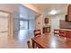 Kitchen and dining area with view to the living room and featuring dark wood cabinets and stainless steel appliances at 7885 W Flamingo Rd # 1016, Las Vegas, NV 89147