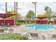 Community pool and lounge area with ample seating and sunshades for residents to relax and enjoy at 7885 W Flamingo Rd # 1016, Las Vegas, NV 89147