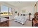 Cozy bedroom features a double bed, a large window and decorative wooden furniture at 8460 Carmel Ridge Ct, Las Vegas, NV 89113