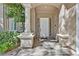 Inviting front entrance with a white door, decorative glass blocks, and elegant column at 8460 Carmel Ridge Ct, Las Vegas, NV 89113