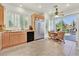 Well-lit kitchen with stainless steel appliances, granite countertops, and an eat-in area at 8460 Carmel Ridge Ct, Las Vegas, NV 89113