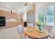 Functional kitchen featuring wooden cabinets, granite countertops, and modern appliances at 8460 Carmel Ridge Ct, Las Vegas, NV 89113