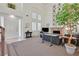 Bright living room with tall windows, a fireplace, and ample seating at 8460 Carmel Ridge Ct, Las Vegas, NV 89113