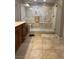 Modern tiled bathroom featuring a frameless glass shower with built in bench and dual shower heads at 8494 Langhorne Creek St, Las Vegas, NV 89139
