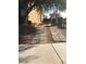 Paver driveway alongside the home, offering additional parking, and access to the backyard at 8494 Langhorne Creek St, Las Vegas, NV 89139