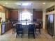 A well-lit kitchen featuring a large island with seating, stainless steel appliances, and recessed lighting at 8494 Langhorne Creek St, Las Vegas, NV 89139