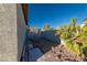 Backyard featuring minimal landscaping, a cinder block wall, and a partial view of the house at 8869 Dove Cove Dr, Las Vegas, NV 89129