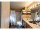 Bathroom featuring a shower-tub combo, a white shower curtain, and double sinks at 8869 Dove Cove Dr, Las Vegas, NV 89129