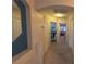 Hallway with neutral colors and a glimpse of carpeted floors in other rooms at 8869 Dove Cove Dr, Las Vegas, NV 89129