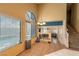 Eat-in kitchen with large windows providing lots of natural light, a chandelier, and tile flooring at 8869 Dove Cove Dr, Las Vegas, NV 89129