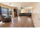 Spacious living room featuring tile floors, fireplace, and large sectional sofa at 8869 Dove Cove Dr, Las Vegas, NV 89129