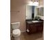 This bathroom has dark stained cabinets and tile floors at 9000 Las Vegas Blvd # 1029, Las Vegas, NV 89123