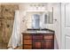 Well-lit bathroom featuring a shower with tile surround and granite vanity at 9000 Las Vegas Blvd # 1029, Las Vegas, NV 89123