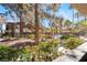 Scenic view from the property with lush landscaping, mature trees, and a community pool at 9000 Las Vegas Blvd # 1029, Las Vegas, NV 89123