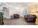 Inviting living room with neutral paint, tile flooring and comfortable brown leather furnishings at 9000 Las Vegas Blvd # 1029, Las Vegas, NV 89123