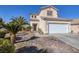 Charming two-story home features a spacious two-car garage and meticulously maintained desert landscaping at 9678 Swaying Elms Ct, Las Vegas, NV 89147