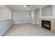 Cozy living area featuring tile flooring, a gas fireplace, and a mantle at 9678 Swaying Elms Ct, Las Vegas, NV 89147