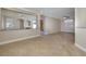 Open living area with tile flooring, a partial wall, and seamless transition to other spaces at 9678 Swaying Elms Ct, Las Vegas, NV 89147