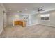 Bright loft with carpet, built-in desk and cabinets, a ceiling fan, and natural light at 9678 Swaying Elms Ct, Las Vegas, NV 89147