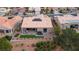 Aerial view of the home featuring desert landscaping, patio, and solar panels on the roof at 10612 Back Plains Dr, Las Vegas, NV 89134