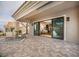 Covered back patio with tiled surface and sliding glass doors offering indoor-outdoor living at 10612 Back Plains Dr, Las Vegas, NV 89134