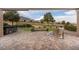 View of a large patio area featuring a hot tub, wicker chair, and a golf course view at 10612 Back Plains Dr, Las Vegas, NV 89134