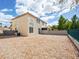 An expansive backyard features gravel landscaping and a secure fenced perimeter at 1123 Scenic Crest Dr, Henderson, NV 89052