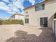 A spacious backyard with a patio area and low-maintenance gravel landscaping at 1123 Scenic Crest Dr, Henderson, NV 89052