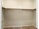 This walk-in closet has carpet and includes rods and shelving for storage at 1123 Scenic Crest Dr, Henderson, NV 89052