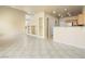 Open living area with tile flooring connects to the kitchen with a bar top counter at 1123 Scenic Crest Dr, Henderson, NV 89052