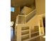 Hallway and staircase with built-in display shelving at 1123 Scenic Crest Dr, Henderson, NV 89052