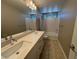 Bathroom with double sinks, a vanity and bath/shower combination at 11260 Burning River St, Las Vegas, NV 89183