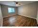 Bright bedroom featuring wood-look floors and a neutral color palette at 11260 Burning River St, Las Vegas, NV 89183