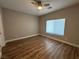 Bedroom with wood-look flooring and a ceiling fan at 11260 Burning River St, Las Vegas, NV 89183