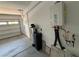 Garage interior with water heater and filter with open door at 11260 Burning River St, Las Vegas, NV 89183