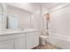 Bathroom with a white sink, toilet, shower, and tile flooring, creating a clean and bright space at 1338 Ossa St, Henderson, NV 89052