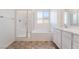 Bathroom featuring a separate glass shower, tub and single sink vanity at 1338 Ossa St, Henderson, NV 89052