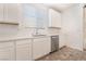 White cabinets and counters pair nicely with stainless steel appliances in this bright kitchen space at 1338 Ossa St, Henderson, NV 89052