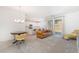 Bright living room featuring modern furniture, neutral colors, and sliding glass doors at 1338 Ossa St, Henderson, NV 89052