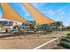 Community playground with shade structures offers a safe and fun environment for children at 1338 Ossa St, Henderson, NV 89052