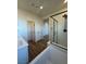 Bathroom featuring wood flooring, walk in shower, and updated vanity at 1586 Crowned Eagle St, Las Vegas, NV 89138