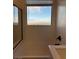 Bright bathroom featuring a soaking tub and a large window with a view at 1586 Crowned Eagle St, Las Vegas, NV 89138