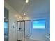 Modern bathroom featuring a glass-enclosed shower and a bright window at 1586 Crowned Eagle St, Las Vegas, NV 89138