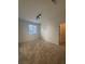 Bedroom with plush carpet, a large window providing natural light, and easy access to a walk-in closet at 1586 Crowned Eagle St, Las Vegas, NV 89138