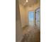 Hallway with carpeted floors, offering access to various rooms with natural light visible through the windows at 1586 Crowned Eagle St, Las Vegas, NV 89138