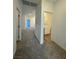 Hallway featuring carpeted floors leading to a bathroom and other rooms, providing a view of the home's layout at 1586 Crowned Eagle St, Las Vegas, NV 89138