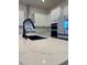 Close-up of a kitchen island with quartz countertop and stainless appliances at 1586 Crowned Eagle St, Las Vegas, NV 89138