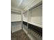 Walk-in closet features shelves, railing, and hanging storage at 1586 Crowned Eagle St, Las Vegas, NV 89138