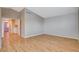 Spacious bedroom with wood floors and a view of the closet and ensuite bathroom at 1800 Summit Pointe Dr, Las Vegas, NV 89117